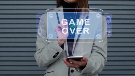 Business-woman-interacts-HUD-hologram-Game-Over