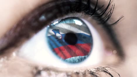 woman-blue-eye-in-close-up-with-the-flag-of-slovenia-in-iris-with-wind-motion.-video-concept