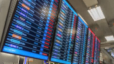 Time-lapse-blur-Air-passengers-Checking-Suvarnabhumi-Airport-departure-screens