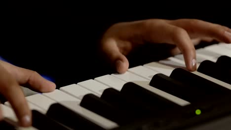 Male-hands-plays-melody-on-piano