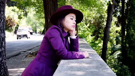 pensive-serious-Asian-Woman-Portrait-,-outdoor