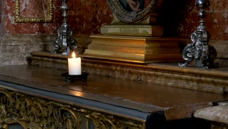 The-candle-burns-in-the-cathedral.-Interior-of-an-old-church