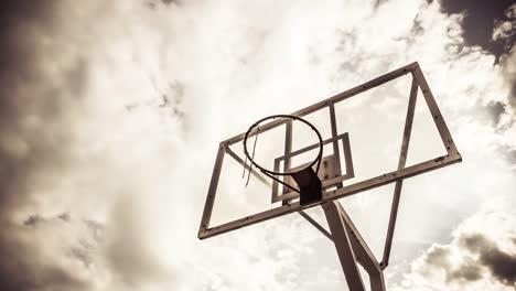 Dramatically-moving-cloud-background-of-A-basketball-ring-in-warm-color