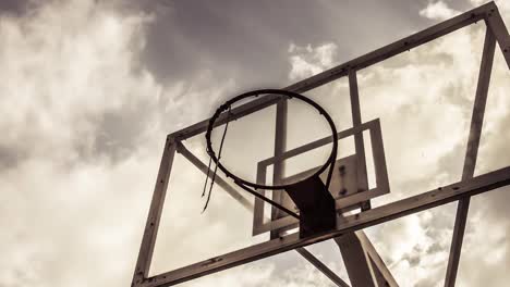 Dramatically-moving-cloud-background-of-A-basketball-ring-in-warm-color