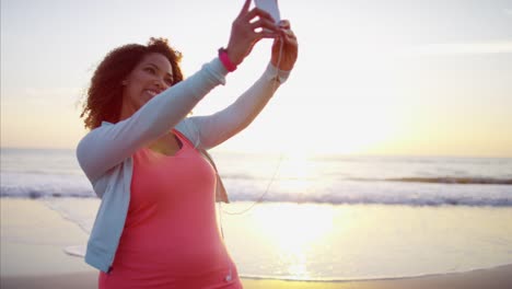 African-American-female-taking-selfie-photo-on-beach