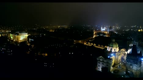 Night-panorama-of-Prague,-panoramic-view-from-the-air-to-the-Old-Town-Square,-lights-of-the-night-city,-Prague