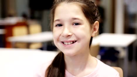 portrait-of-happy-smiling-preteen-girl-face-at-school-classroom