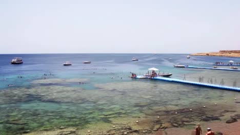 Visitors-to-the-resort-have-fun-on-the-shores-of-the-Red-Sea.-Single-frame-shooting,-time-lapse