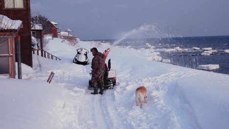 Man-Cleans-The-Snow-Machine-Road-From-Snow-In-The-Winter