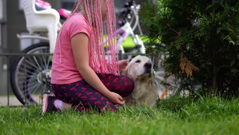 life-with-pets-in-a-modern-city---a-girl-with-an-unconventional-appearance-stroking-her-dog-on-the-street