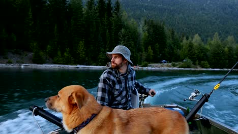 Fishermen-travelling-with-his-dog-in-the-boat-4k