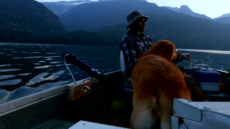 Fisherman-fishing-with-his-dog-in-the-river-4k