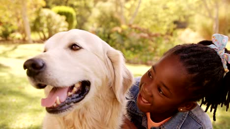 Portrait-of-cute-girl-is-petting-a-dog