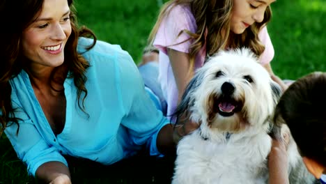 Family-playing-with-their-dog-in-the-park