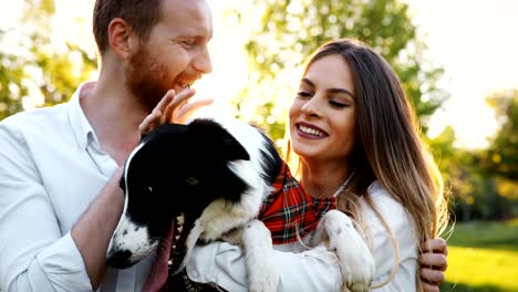 Beautiful-couple-walking-dogs-and-bonding-in-nature