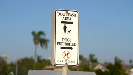 Dogs-prohibited-and-dog-leash-area-sign-in-4k-slow-motion