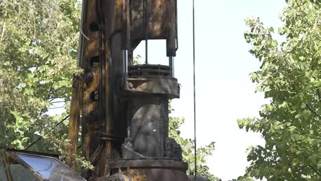 Construction-drill-auger-working-in-the-countryside