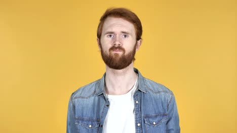 Redhead-Man-Shaking-Head-to-Reject-Isolated-on-Yellow-Background