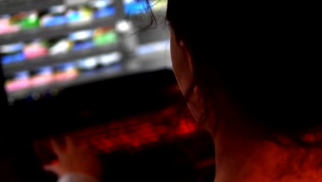 Hacker-girl-Woman-Using-Laptop-Computer-Touchscreen-In-Dark-Room