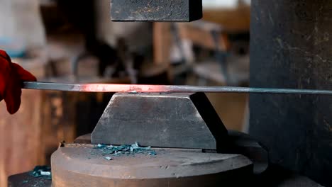 Red-hot-iron-lingot-on-a-press-machine