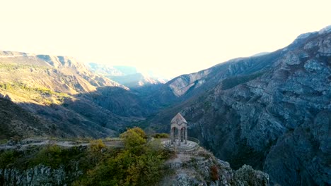 A-small-chapel-on-the-mountain-edge-against-at-the-morning.-Aerial-shot