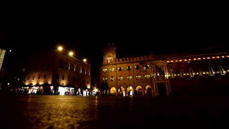 People-go-through-an-old-night-city,-Europe,-Prague,-time-lapse