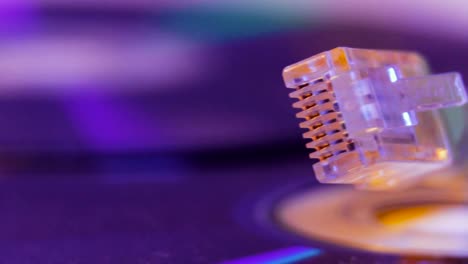 Closeup-of-Ethernet-cable-with-it's-reflection-on-blank-disc