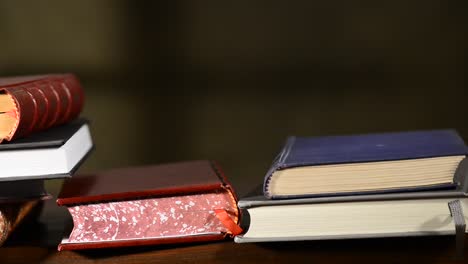 puting--books-on-the-table,-no-camera-movement