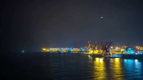 night-illuminated-shenzhen-city-working-port-industrial-bay-cranes-panorama-4k-time-lapse-china