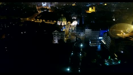 Night-panorama-of-Prague,-panoramic-view-from-the-air-to-the-old-town-and-Charles-Bridge,-lights-of-the-night-city