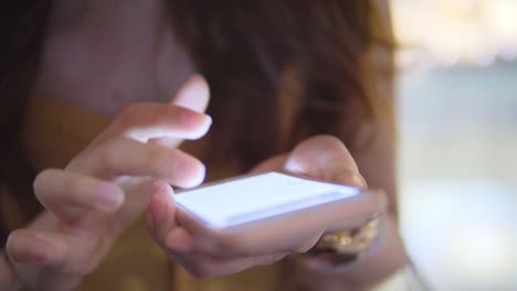 Young-Woman-use-of-mobile-phone-in-shopping-mall