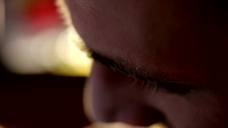 Close-up-of-face-of-a-bearded-tattoo-master.Close-up-of-face-of-a-bearded-tattoo-master-who-holds-in-his-hand-Tattoo-machine.-Portrait-of-a-tattoo-artist-while-working-in-a-tattoo-parlor.