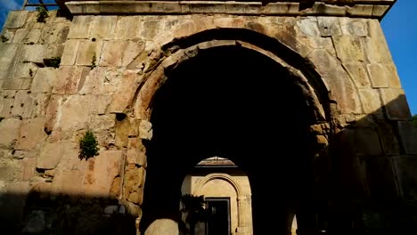 Outside-view-of-old-Gelati-Monastery-walls-and-arches,-ancient-architecture