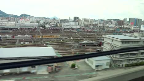 Bullet-Train-Pulling-Into-Hiroshima-Railway-Station,-Hiroshima,-Japan