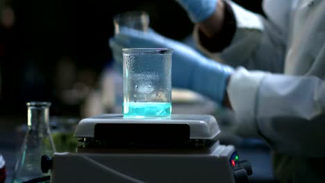 Close-up-of-experiments-being-conducted-in-a-chemistry-lab