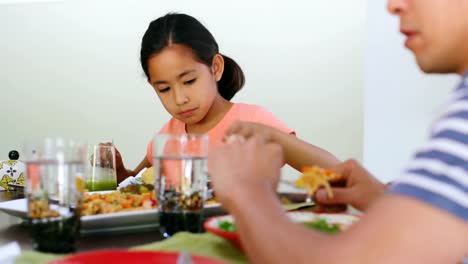 Family-members-having-breakfast-on-dining-table-4k