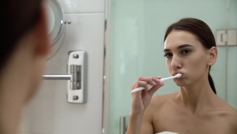 Dental-Health.-Woman-Brushing-Teeth-In-Bathroom