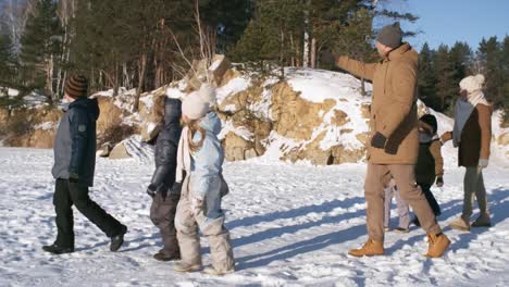 Active-Family-Walking-over-Frozen-Lake