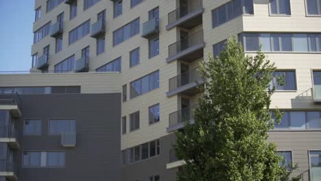 Residential-building-in-New-microdistrict.-Close-up-Of-An-Apartment-Blocks.-The-building-features-exterior-with-small-balconies