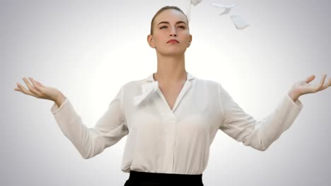 Angry-young-woman-rips-paper-documents,-throw-it-at-the-camera-on-white-background