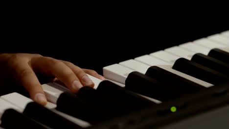 Male-hands-plays-piano