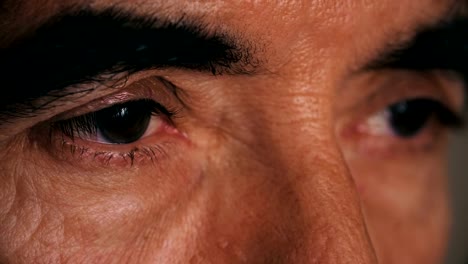 Sad-and-thoughtful-mature-man's-eyes--close-up