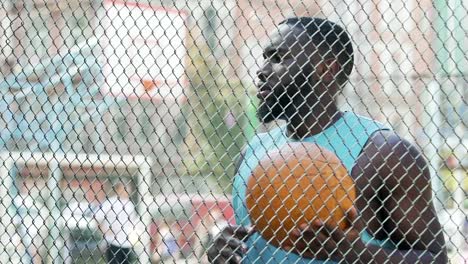 Basketball-coach-eagerly-waiting-for-team-at-sports-ground,-outdoor-training