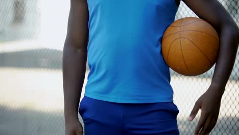 Closeup-of-male-hands-holding-ball,-preparing-for-game,-active-lifestyle