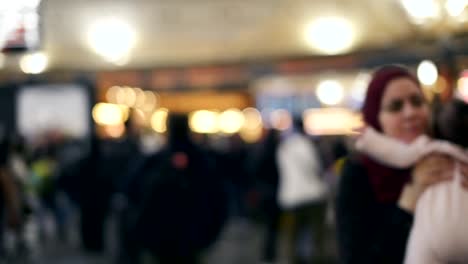 Defocused-traveler-and-crowded-people-walking-in-the-airport.