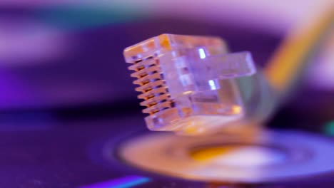 Closeup-of-Ethernet-cable-with-it's-reflection-on-blank-disc