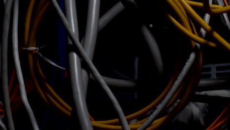 Grey-and-yellow-wires-close-up,-technological-progress,-telecommunications