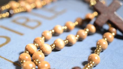 wooden-rosary-on-the-bible