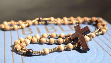 wooden-rosary-on-the-bible