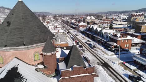 Day-Rising-Aerial-Establishing-Shot-Small-Rust-Belt-Town-in-Winter